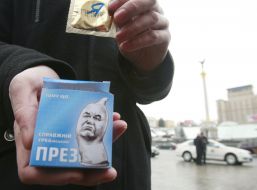 The participant of action holds a box with a contraceptive