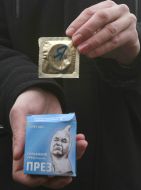 The participant of action holds a box with a contraceptive