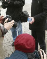 The participant of action holds a box with a contraceptive