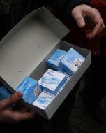 The participant of action holds a box with a contraceptive