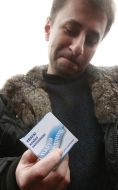 Sergey Melnichenko holds a box with a contraceptive