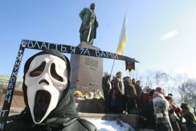 A young man in a mask of death