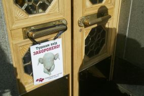 The poster with a picture of a chicken carcass