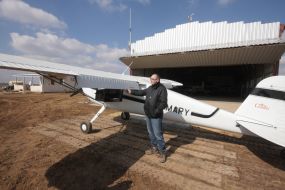 Sergey Shevchuk near the Cessna-140 aircraft