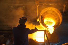 The worker of factory in melt department