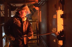 The worker of factory in melt department