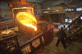 The worker of factory in melt department