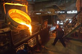 The worker of factory in melt department