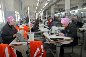 The convicts works on a sewing machine