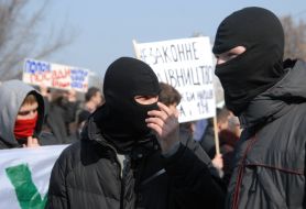 Young people in black masks