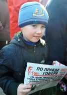 Boy holding a newspaper