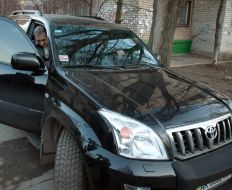 Anatoliy Gritsenko sits down in a car