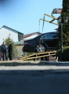 Evacuates takes away the fired car of Sergey Dyadechko
