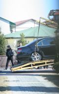 Evacuates takes away the fired car of Sergey Dyadechko