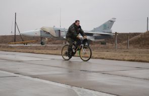 The serviceman riding a bike