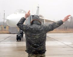 Runway controller regulates the motion of airplane SU-24M