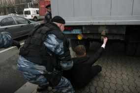 Militia employee detains the participant of action