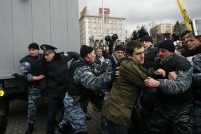 Militia employees detain the participants of action