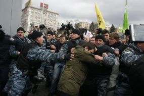 Militia employees detain the participants of action