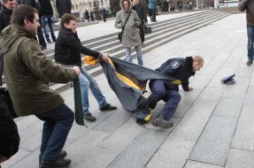 Militia employees detain the participants of action