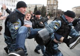 Militia employees detain the participants of action