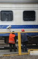 Workers wash a carriage