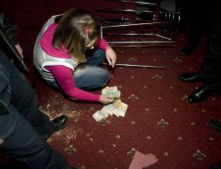 The girl cashier collects money