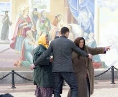 The guard takes away two elderly women