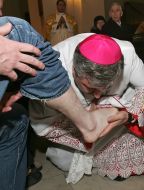 The priest conducts the rite of foot washing