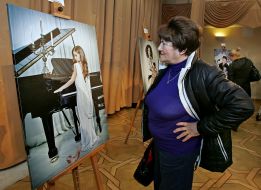 Woman considers photographic