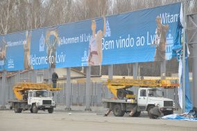 Workers put up placards