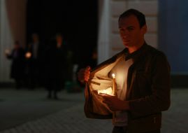 Believing carries a lighted candle home