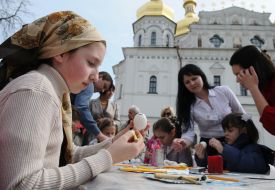 The children paint Easter eggs