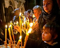 The believer puts a candle