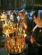 The believer puts a candle