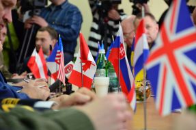 Participants in the ceremony of signing a tripartite agreement