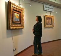 Visitor examines a picture