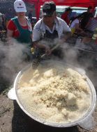 The cook prepares a pilau