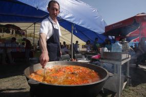 The cook prepares a pilau