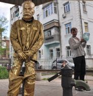 Man at the monument to Stalin