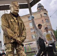 Man at the monument to Stalin