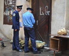 AMilitiamen stand near the head of Stalin