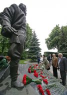Participants of ceremony of laying-on of flowers to the monument to Kozhedub 