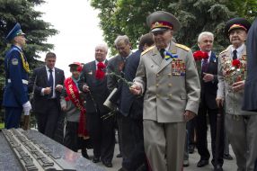 Participants of ceremony of laying-on of flowers to the monument to Kozhedub