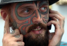 A man with a tattoo on his face