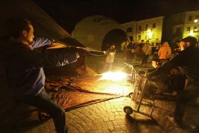 The participants of festival inflates a thermal balloon