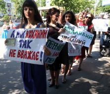 The girls hold placards