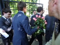 A man carries flowers