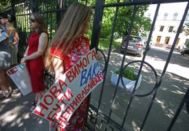 The girls hold placards