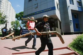 The participants of action carry logs